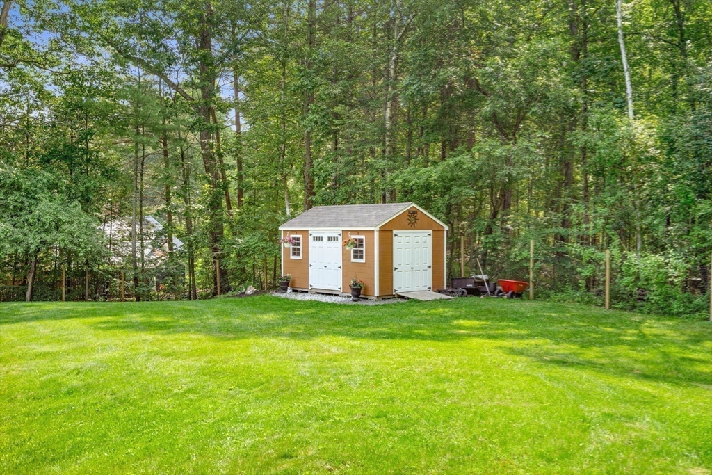 115 Depot Road Boxford, MA 01921 - Photo 31 of 40 a view of a house with a yard