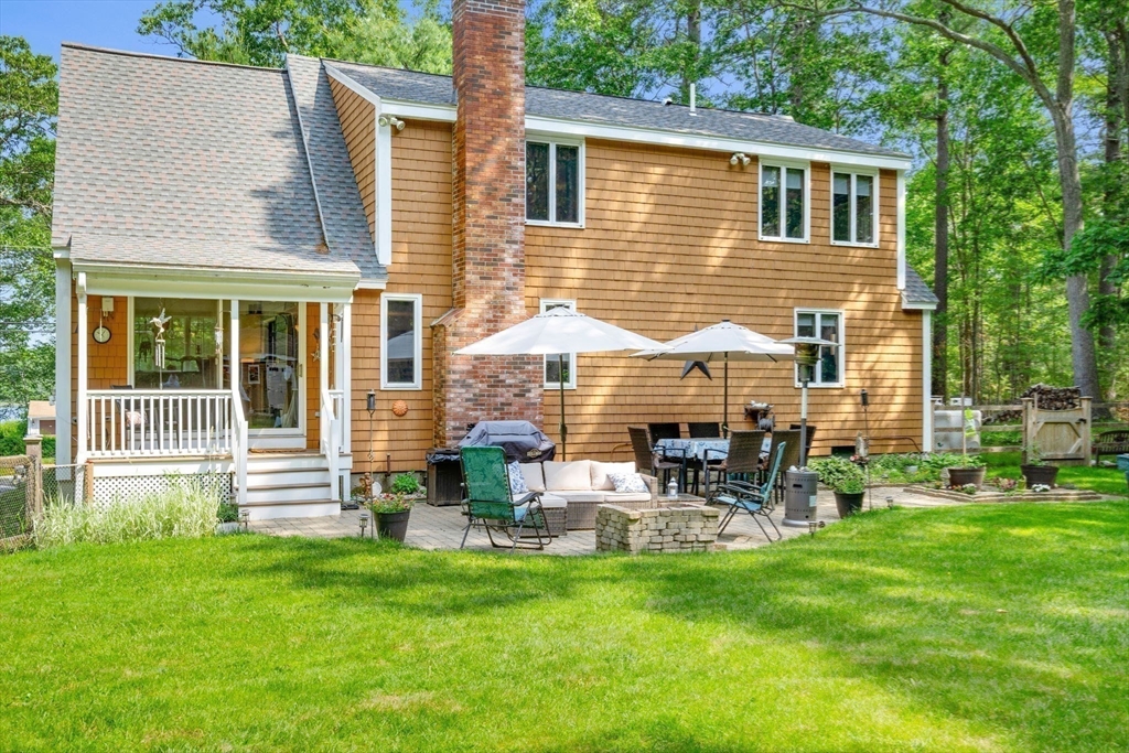 115 Depot Road Boxford, MA 01921 - Photo 32 of 40 a backyard of a house with yard and outdoor seating