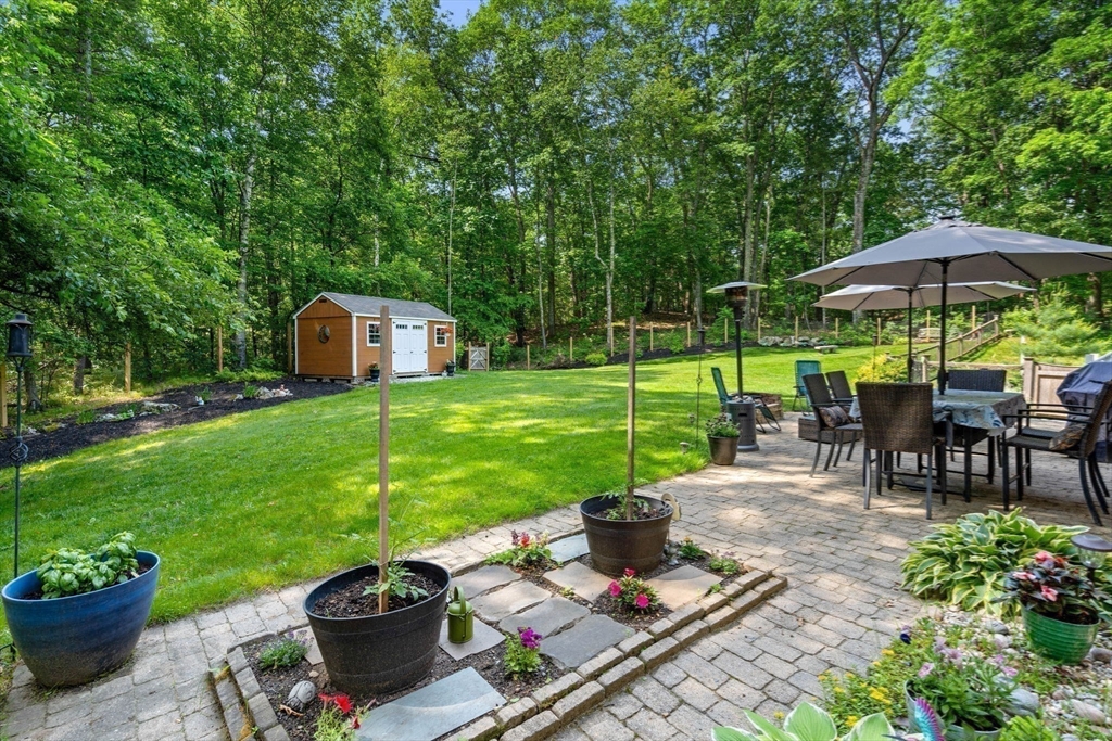 115 Depot Road Boxford, MA 01921 - Photo 7 of 40 a view of a backyard with sitting area