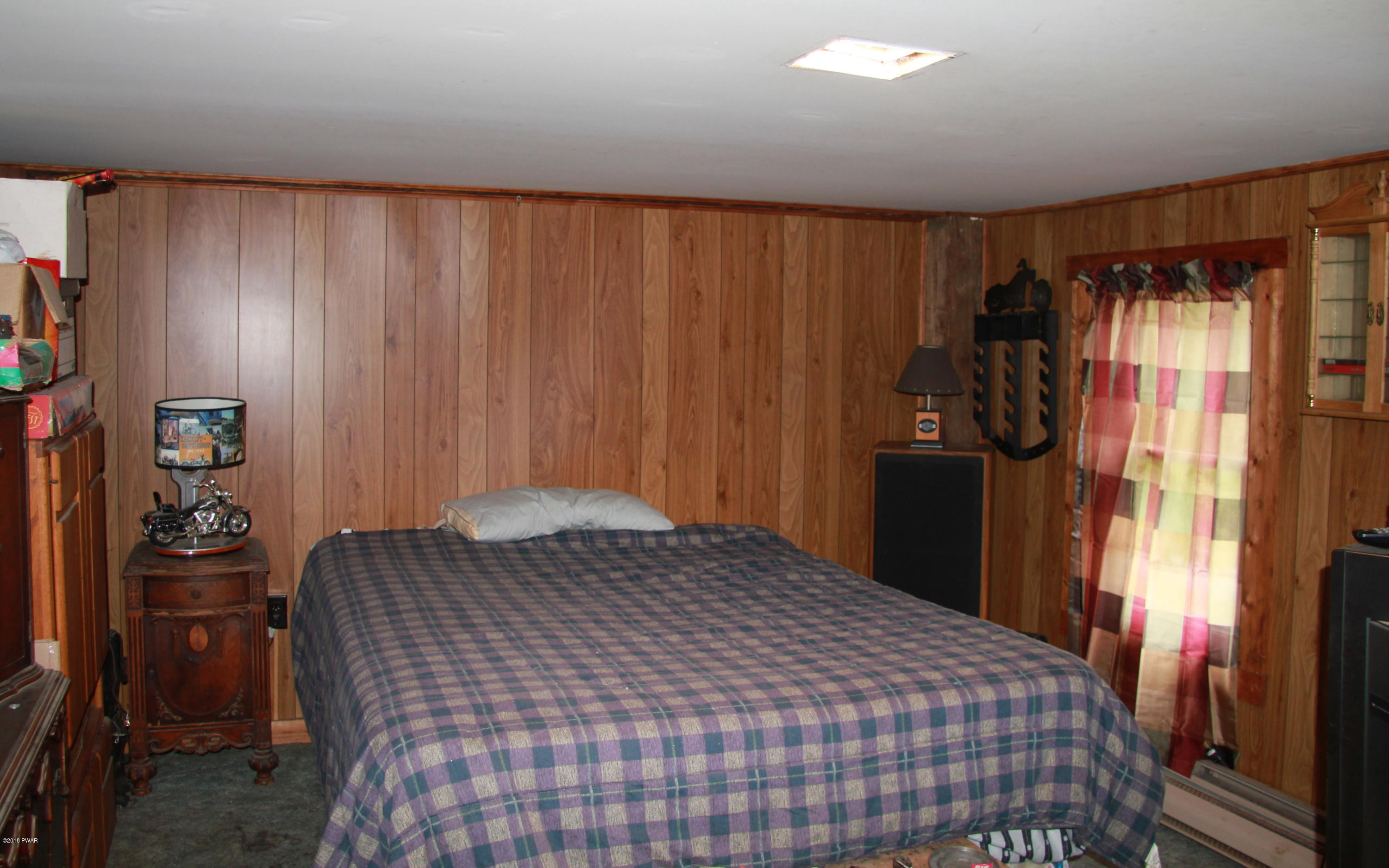 183 J J Road Moscow, PA 18444 - Photo 11 of 16 a bedroom with a bed and a closet