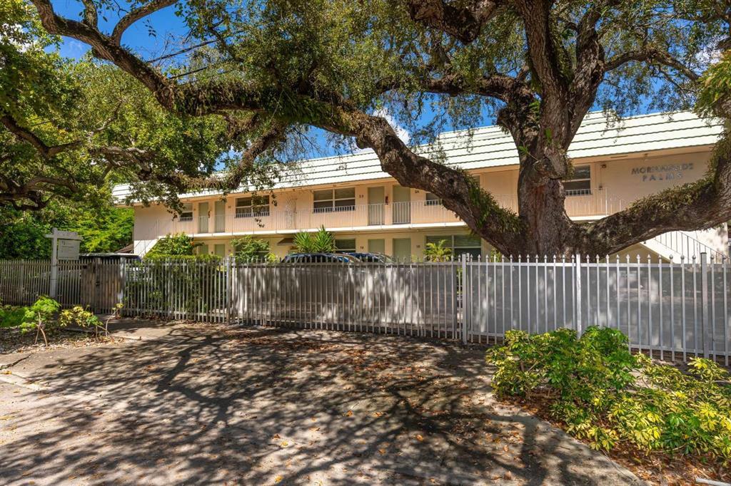 651 Northeast 60th Street, Unit 22 Miami, FL 33137 - Photo 12 of 12 a front view of a house with a yard