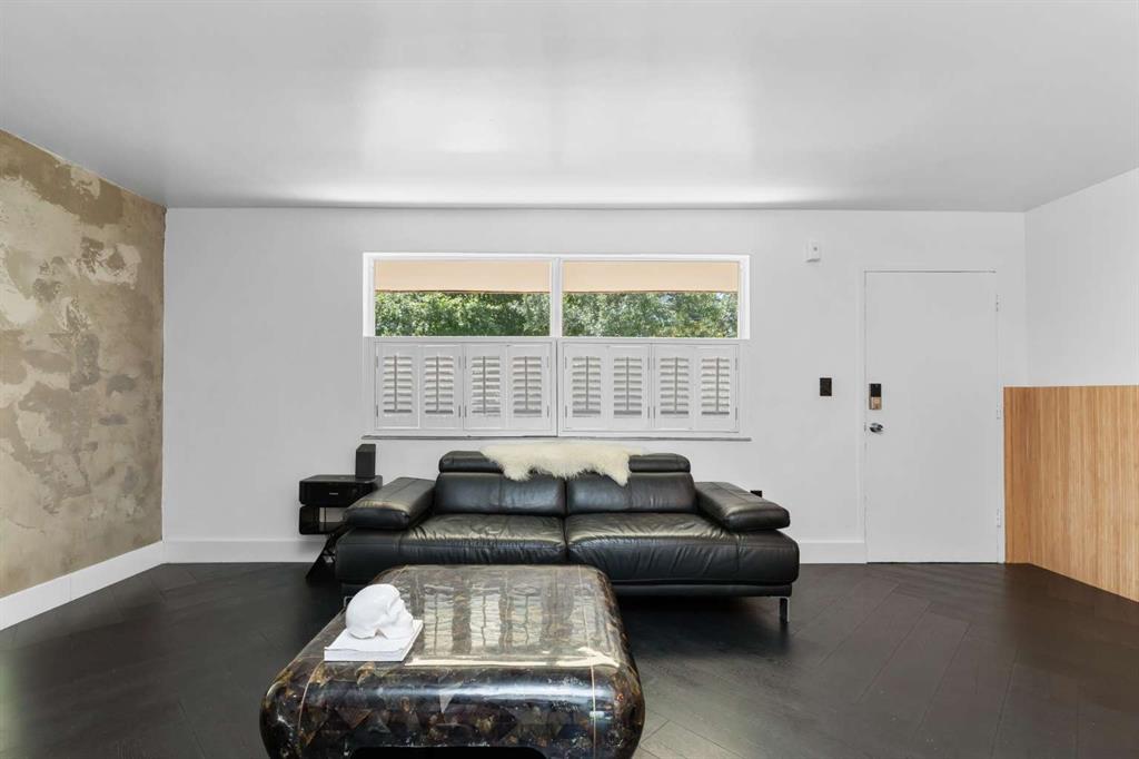 651 Northeast 60th Street, Unit 22 Miami, FL 33137 - Photo 4 of 12 a living room with furniture and a large window