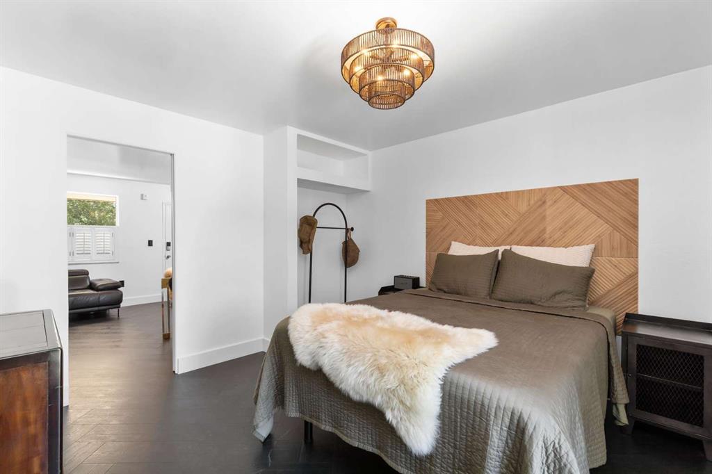 651 Northeast 60th Street, Unit 22 Miami, FL 33137 - Photo 6 of 12 a bedroom with a bed and a chair