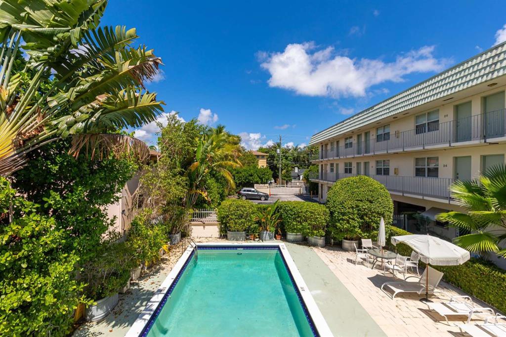 651 Northeast 60th Street, Unit 22 Miami, FL 33137 - Photo 9 of 12 a view of a house with backyard and sitting area