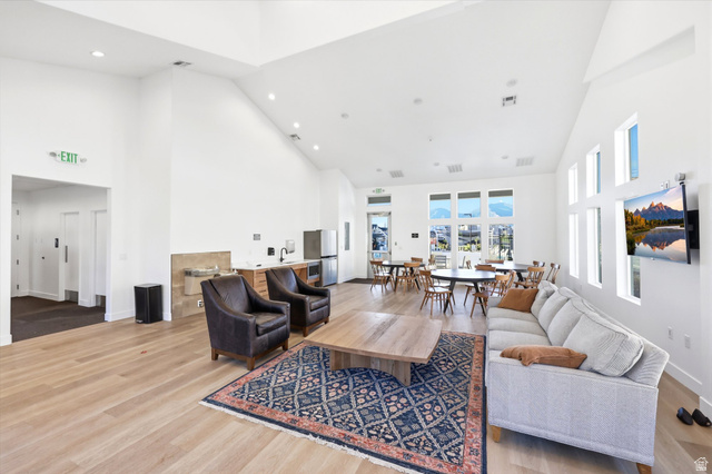 4646 Alder Drive, Unit 223 Mapleton, UT 84664 - Photo 27 of 35 Spacious communal area featuring light wood-finish flooring, vaulted ceilings, and recessed lighting