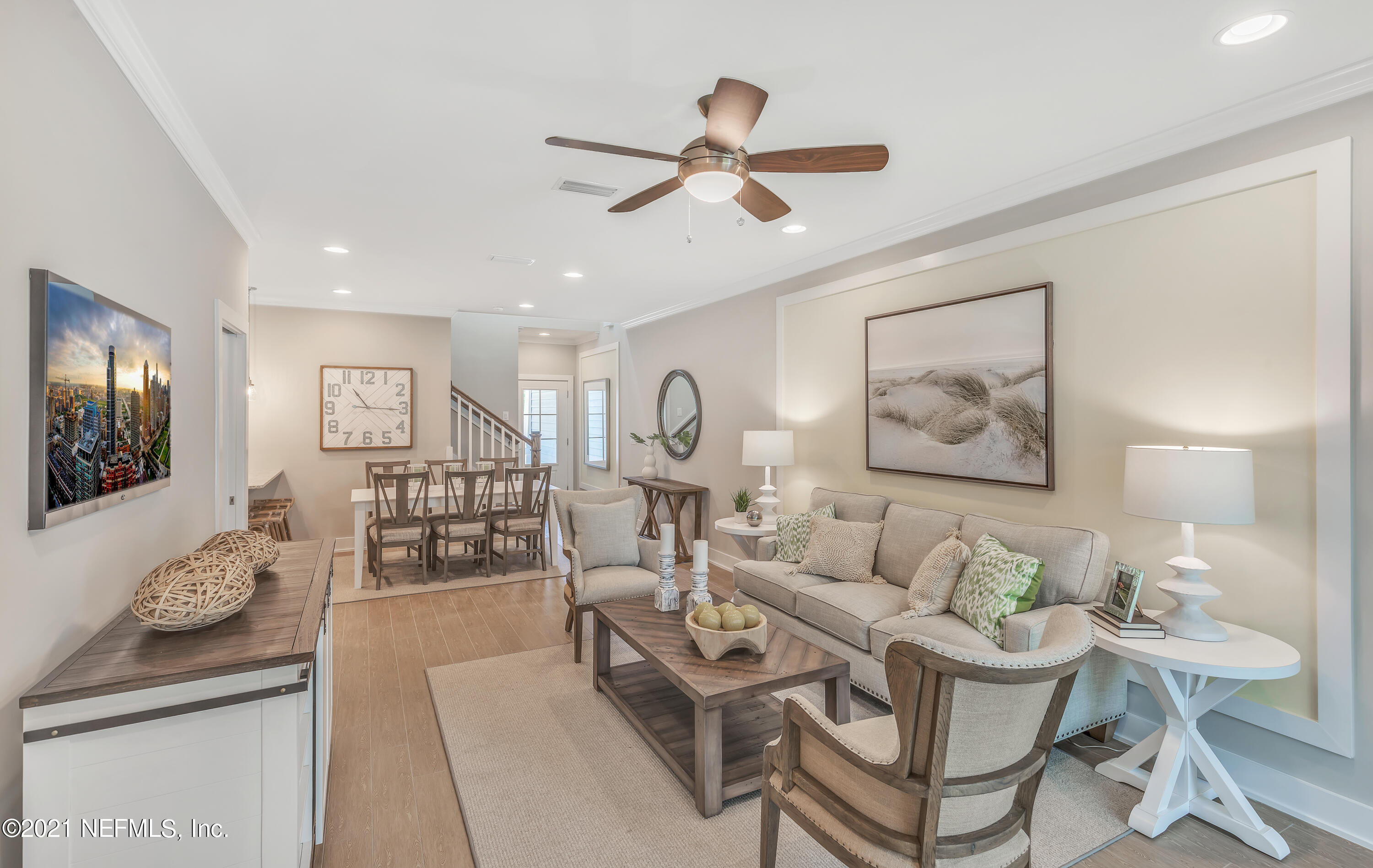 236 Charlie Way St. Augustine, FL 32095 - Photo 12 of 24 a living room with furniture and a flat screen tv