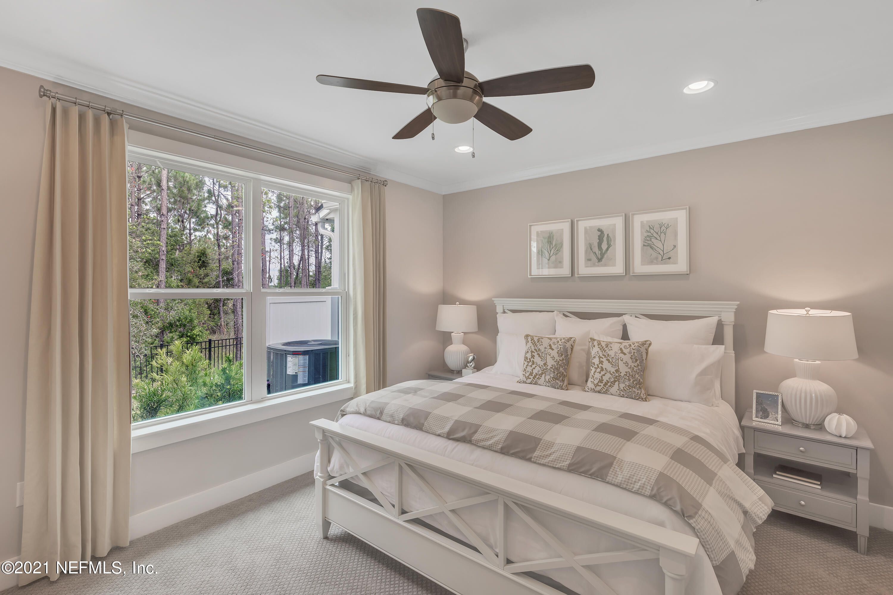 236 Charlie Way St. Augustine, FL 32095 - Photo 13 of 24 a bedroom with a large bed and a large window