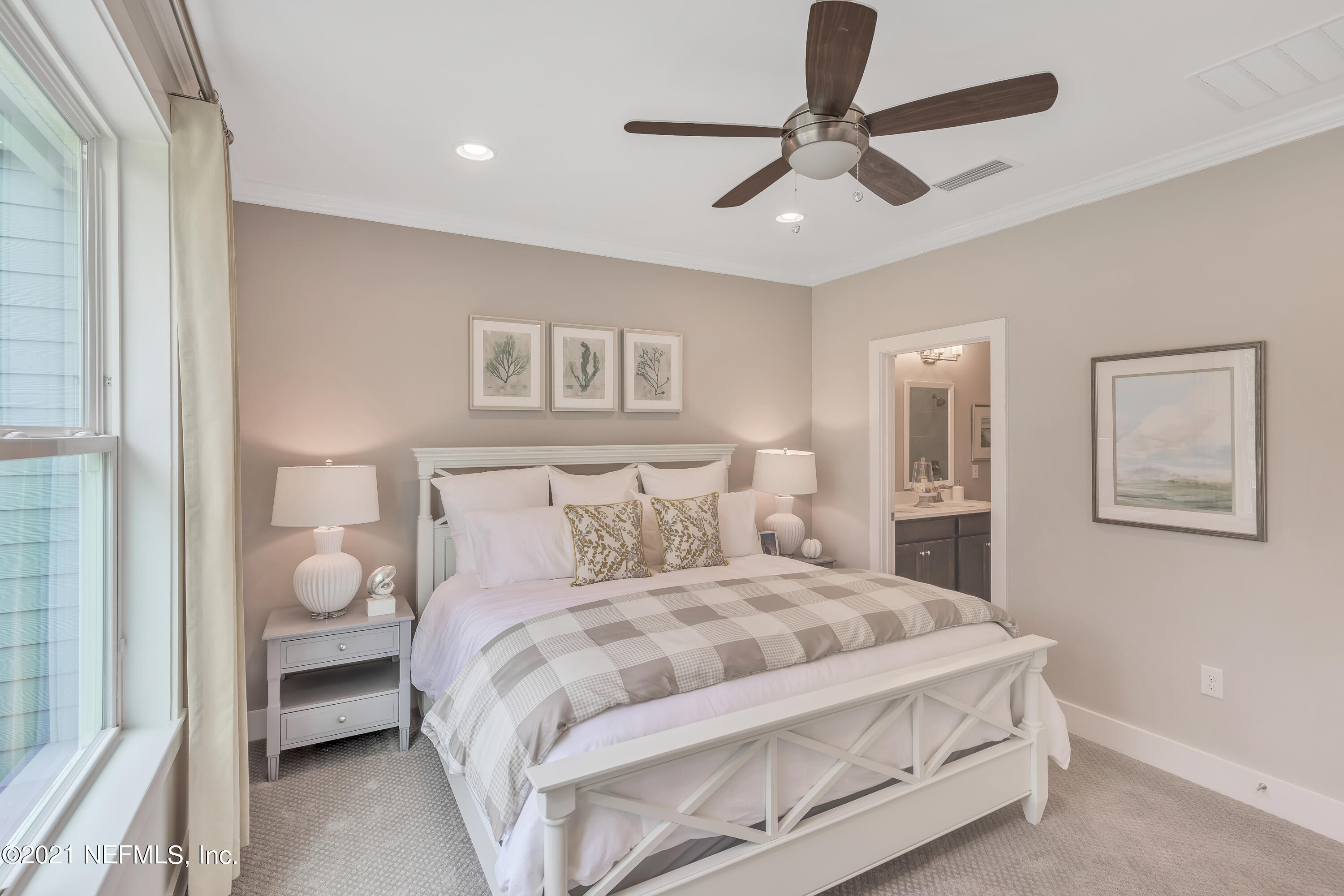 236 Charlie Way St. Augustine, FL 32095 - Photo 14 of 24 a bedroom with a bed and a painting on the wall