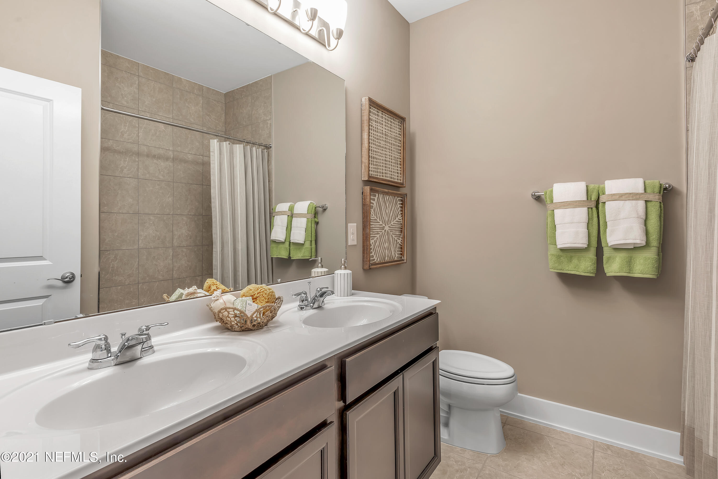 236 Charlie Way St. Augustine, FL 32095 - Photo 19 of 24 a bathroom with a granite countertop sink mirror and toilet