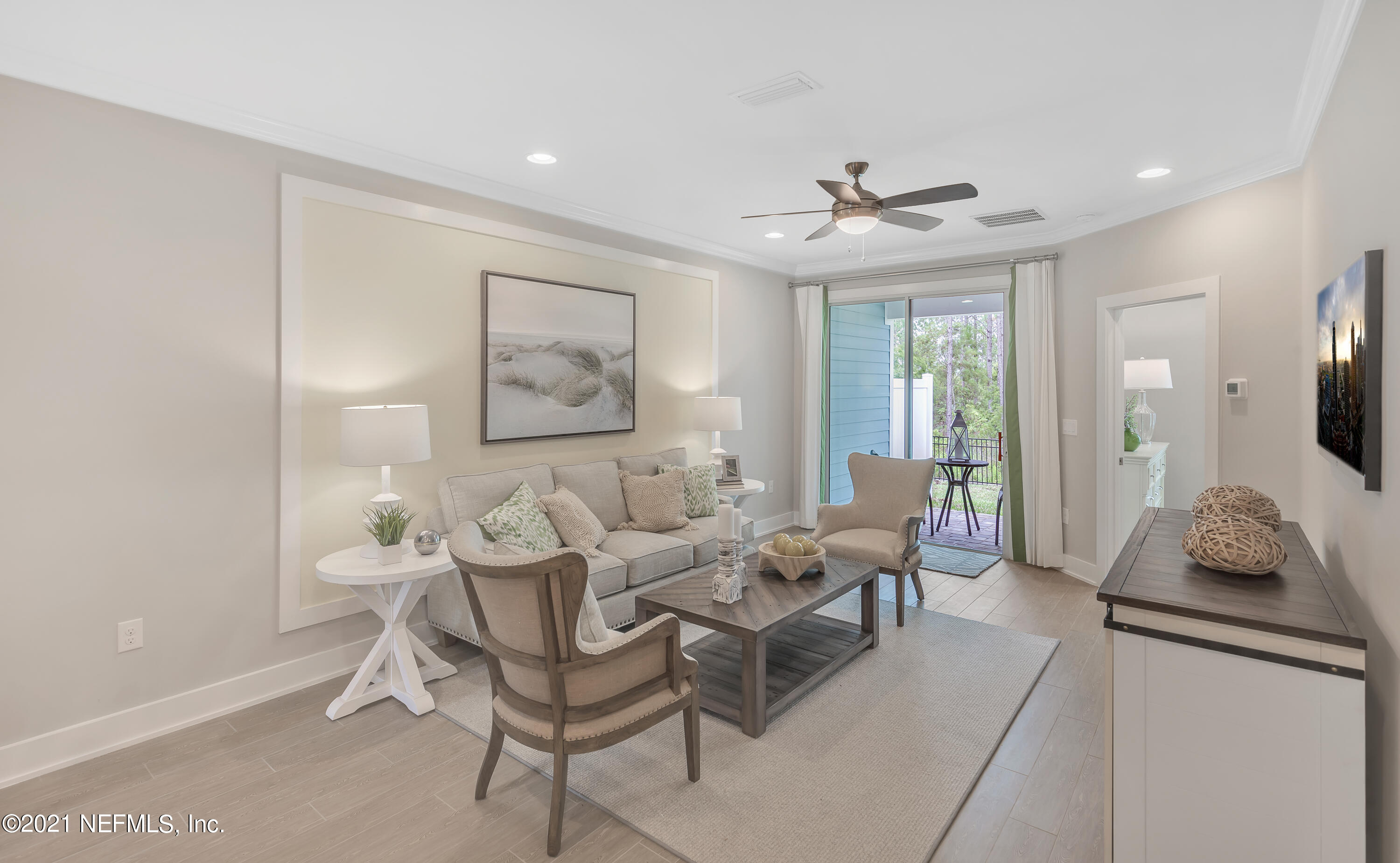 236 Charlie Way St. Augustine, FL 32095 - Photo 8 of 24 a living room with furniture and a flat screen tv