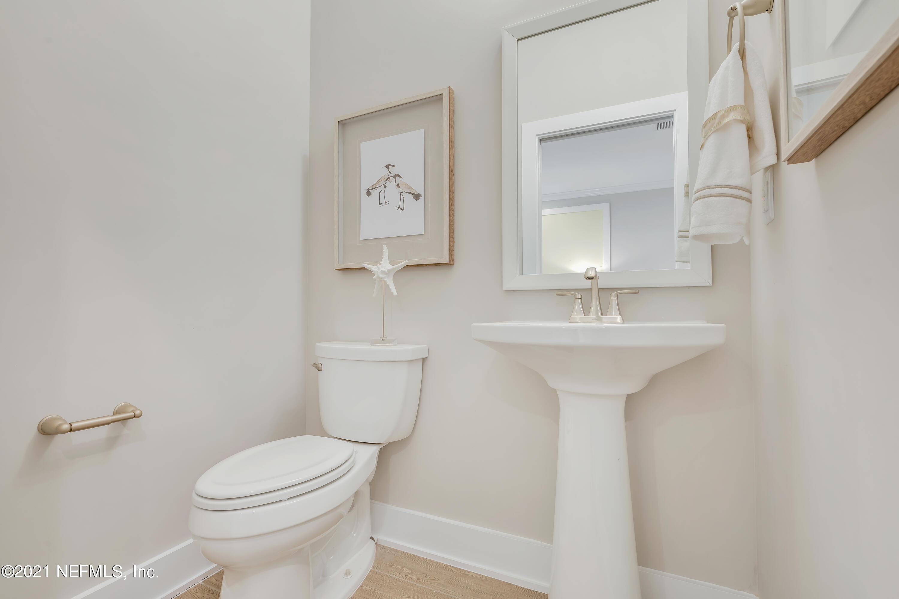 236 Charlie Way St. Augustine, FL 32095 - Photo 10 of 24 a bathroom with a sink toilet and mirror
