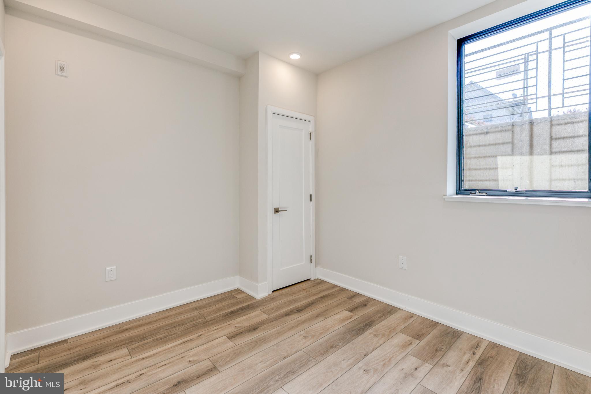 1506 North 8th Street, Unit 1 Philadelphia, PA 19122 - Photo 16 of 18 wooden floor in an empty room