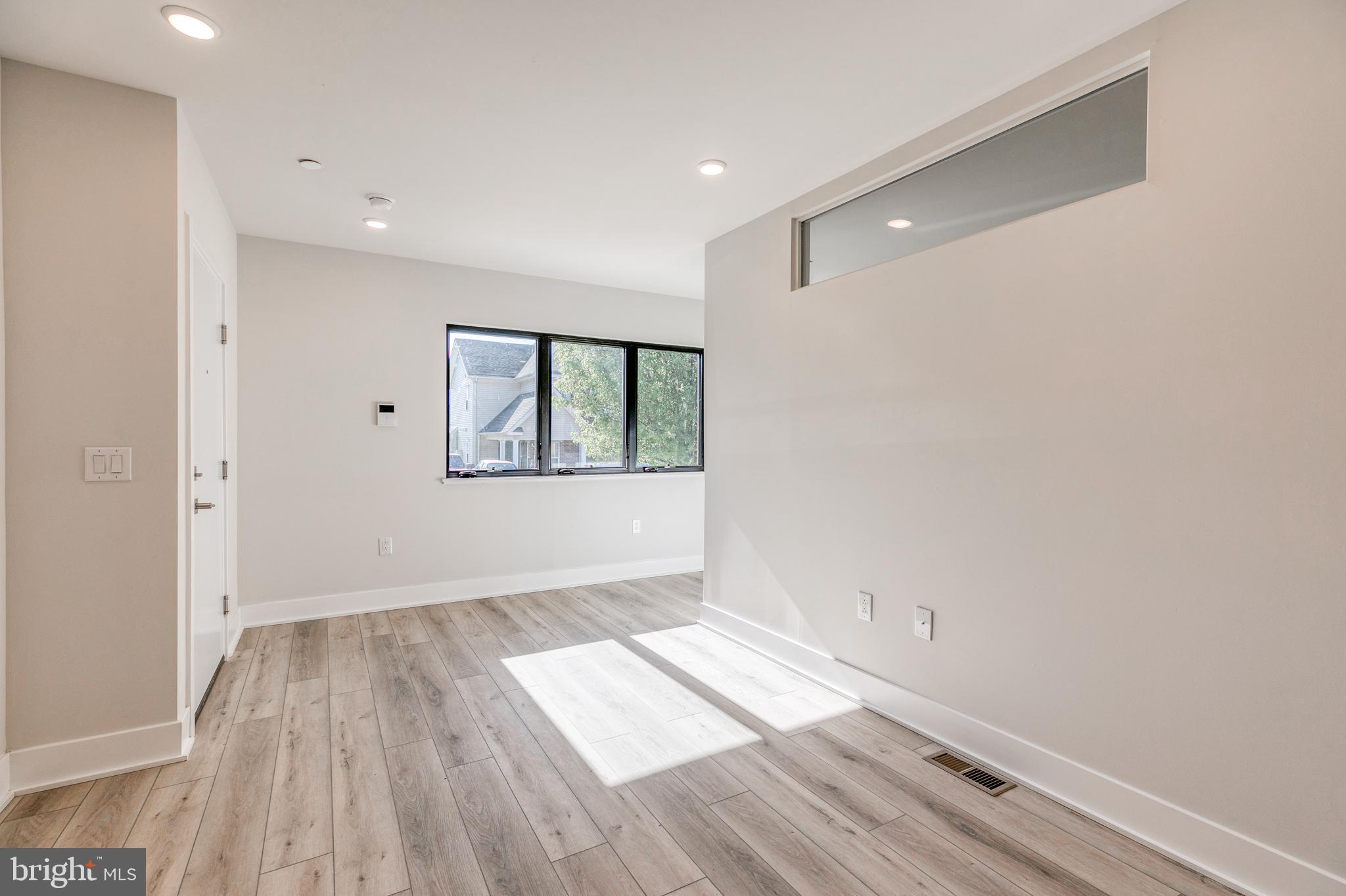 1506 North 8th Street, Unit 1 Philadelphia, PA 19122 - Photo 18 of 18 a view of wooden floor in an empty room