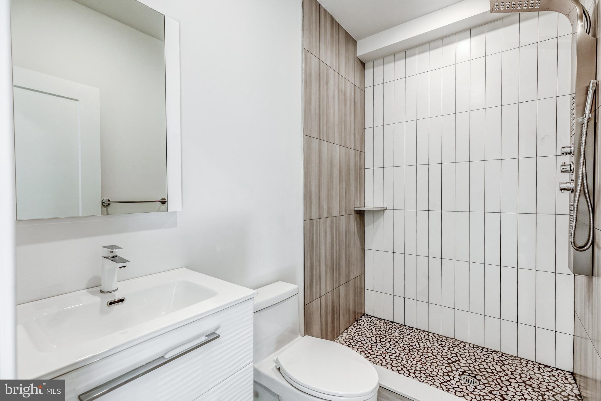 1506 North 8th Street, Unit 1 Philadelphia, PA 19122 - Photo 10 of 18 a bathroom with a sink toilet and shower