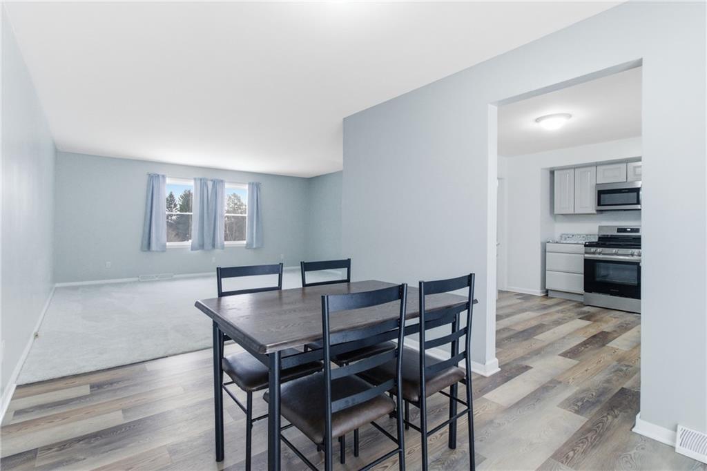 185 Sunset Drive Indiana, PA 15701 - Photo 11 of 29 a view of a dining room with furniture and wooden floor