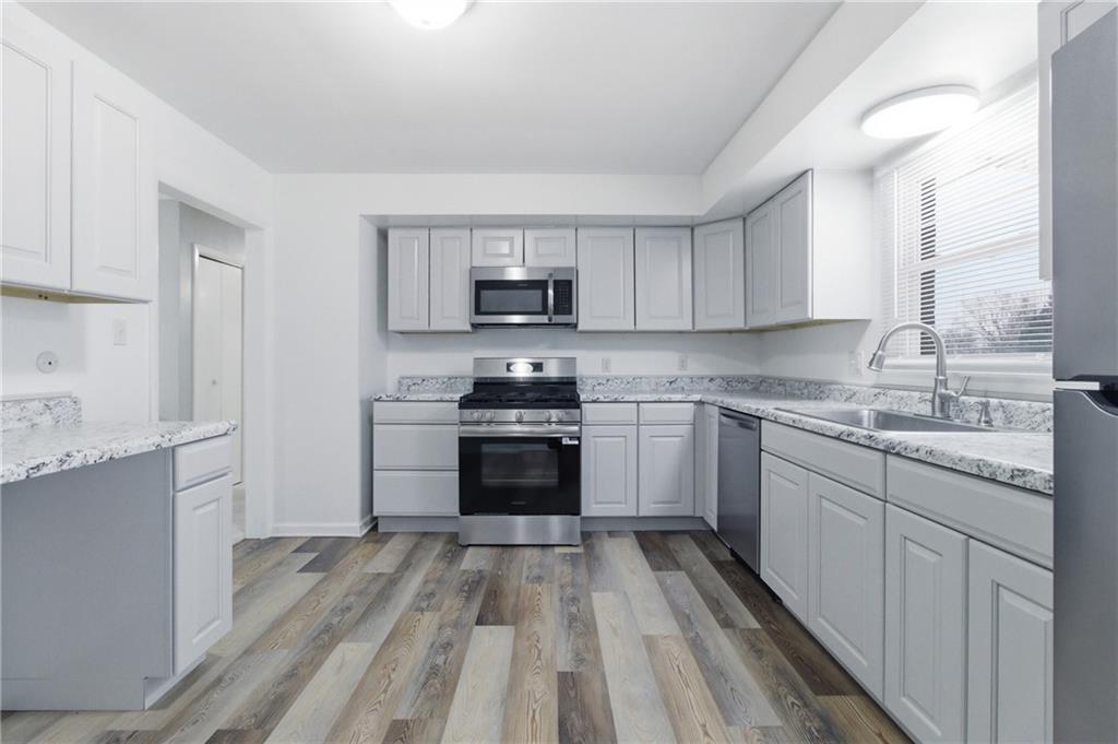185 Sunset Drive Indiana, PA 15701 - Photo 12 of 29 a kitchen with granite countertop a stove top oven sink and cabinets