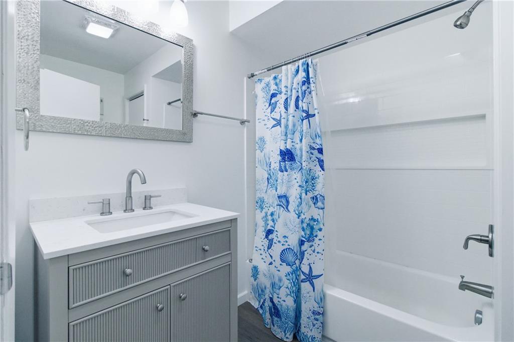 185 Sunset Drive Indiana, PA 15701 - Photo 16 of 29 a bathroom with a sink a mirror a shower and a bathtub