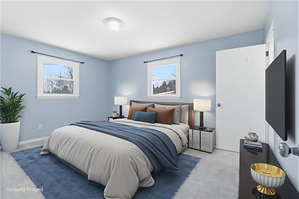 185 Sunset Drive Indiana, PA 15701 - Photo 19 of 29 a bedroom with a bed and a flat screen tv