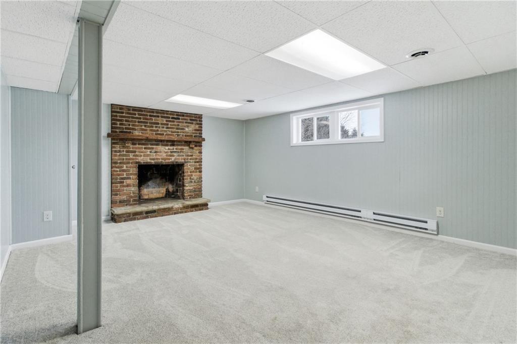 185 Sunset Drive Indiana, PA 15701 - Photo 23 of 29 an empty room with fireplace and fan