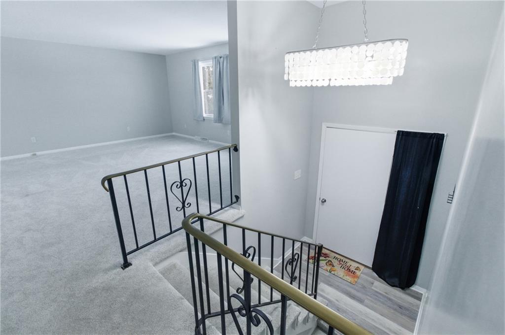 185 Sunset Drive Indiana, PA 15701 - Photo 5 of 29 a view of staircase with railing and white walls