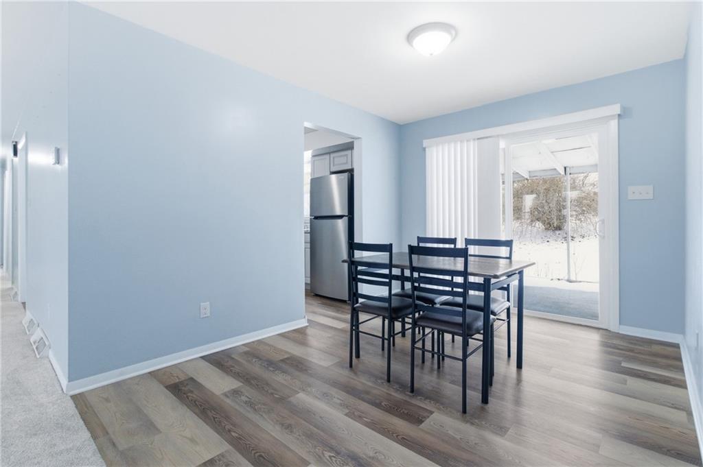 185 Sunset Drive Indiana, PA 15701 - Photo 10 of 29 a view of a dining room with furniture and wooden floor