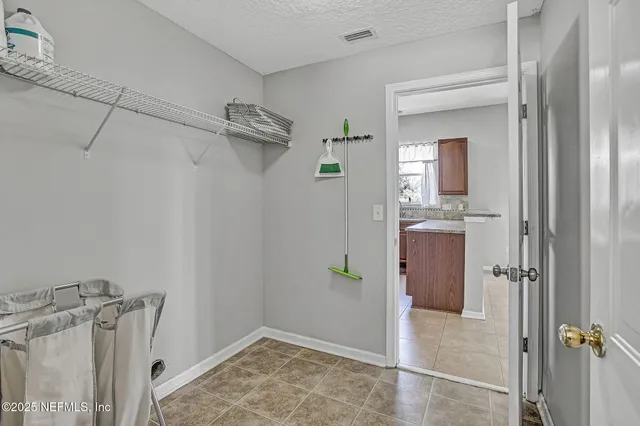 a view of a bathroom from a hallway