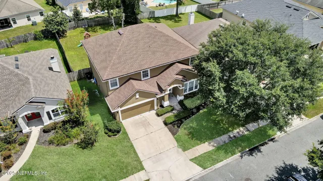 an aerial view of a house with a garden