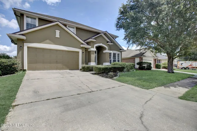 a front view of a house with yard