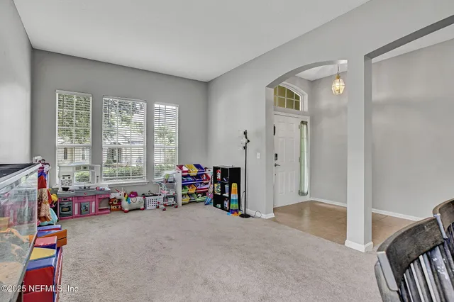 a view of a livingroom with shelves