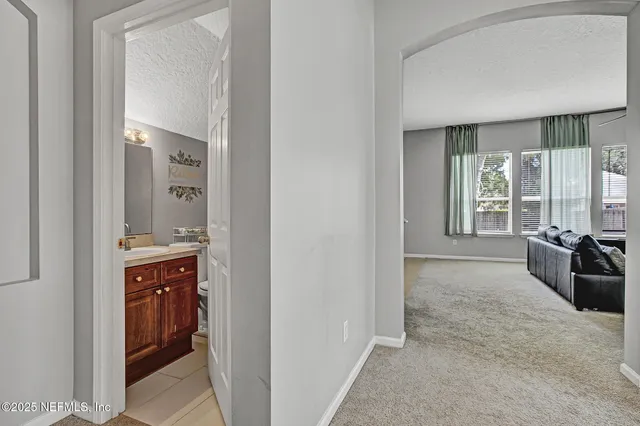 a view of a bathroom from the hallway