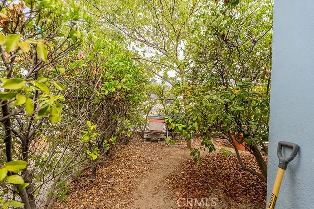 a kitchen with stainless steel appliances a stove a sink and a refrigerator