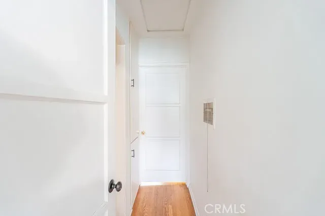 a kitchen with stainless steel appliances a chimney and a cabinets