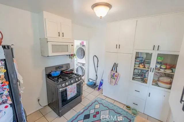 a kitchen with a refrigerator and a sink