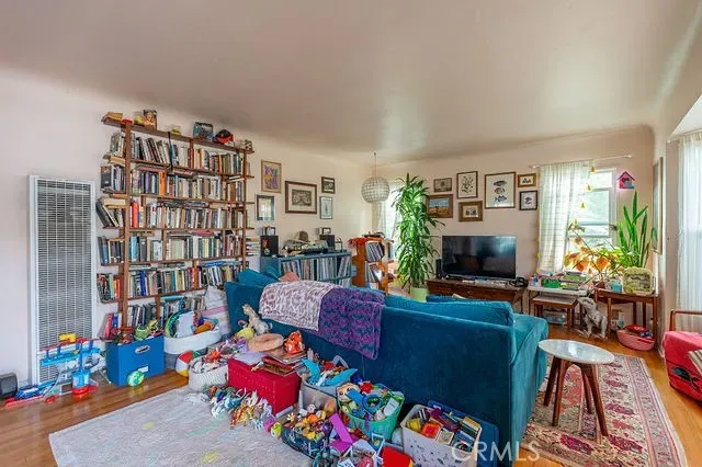 a living room with furniture and a table