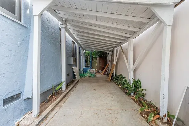 an aerial view of a house with a yard basket ball court
