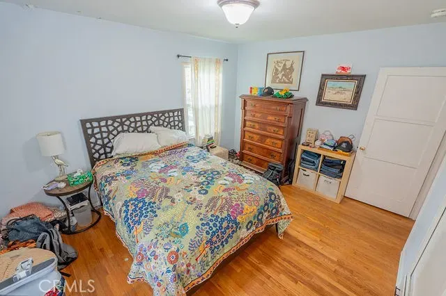 a bedroom with a bed and a table in it