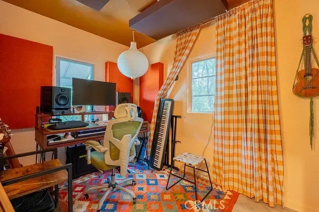 a bathroom with a toilet and shower curtain