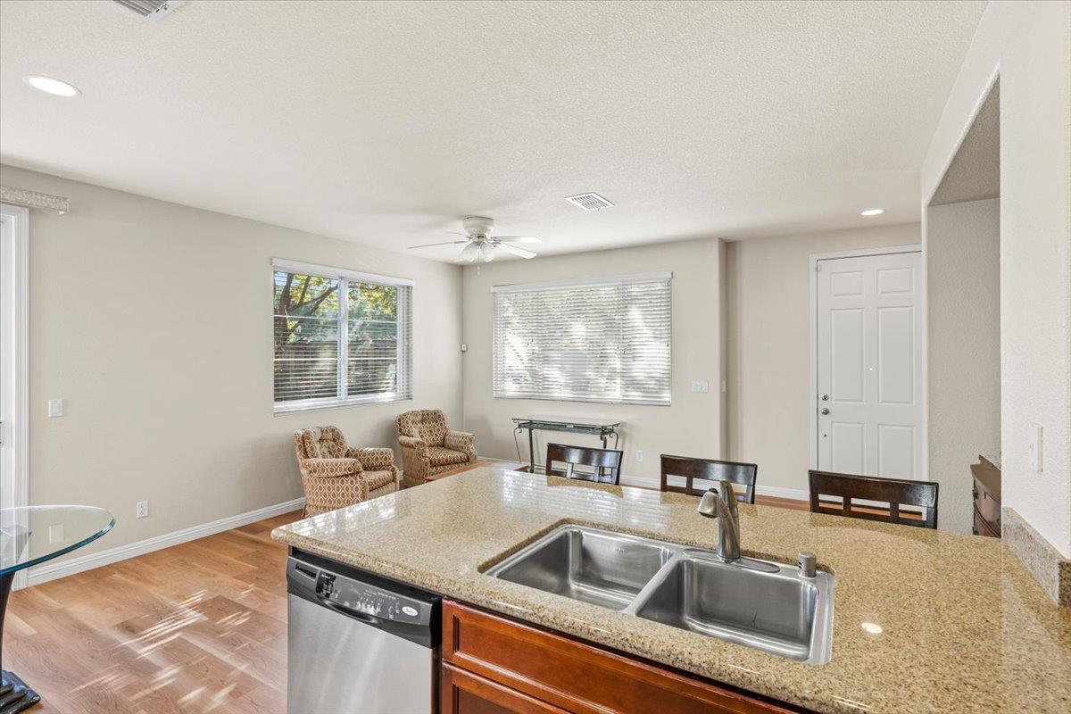 1000 Impressionist Loop Roseville, CA 95747 - Photo 11 of 33 a kitchen with a sink cabinets and a granite counter tops