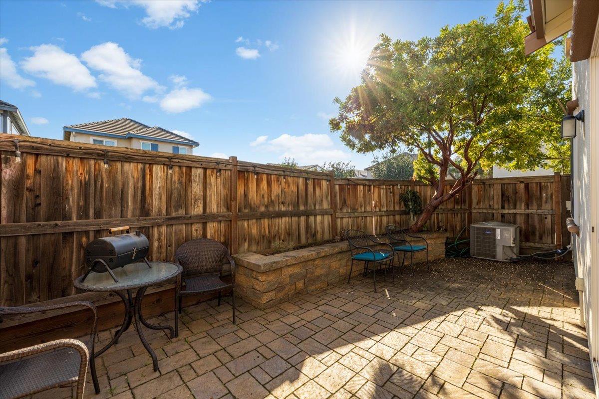 1000 Impressionist Loop Roseville, CA 95747 - Photo 14 of 33 a backyard of a house with barbeque oven table and chairs