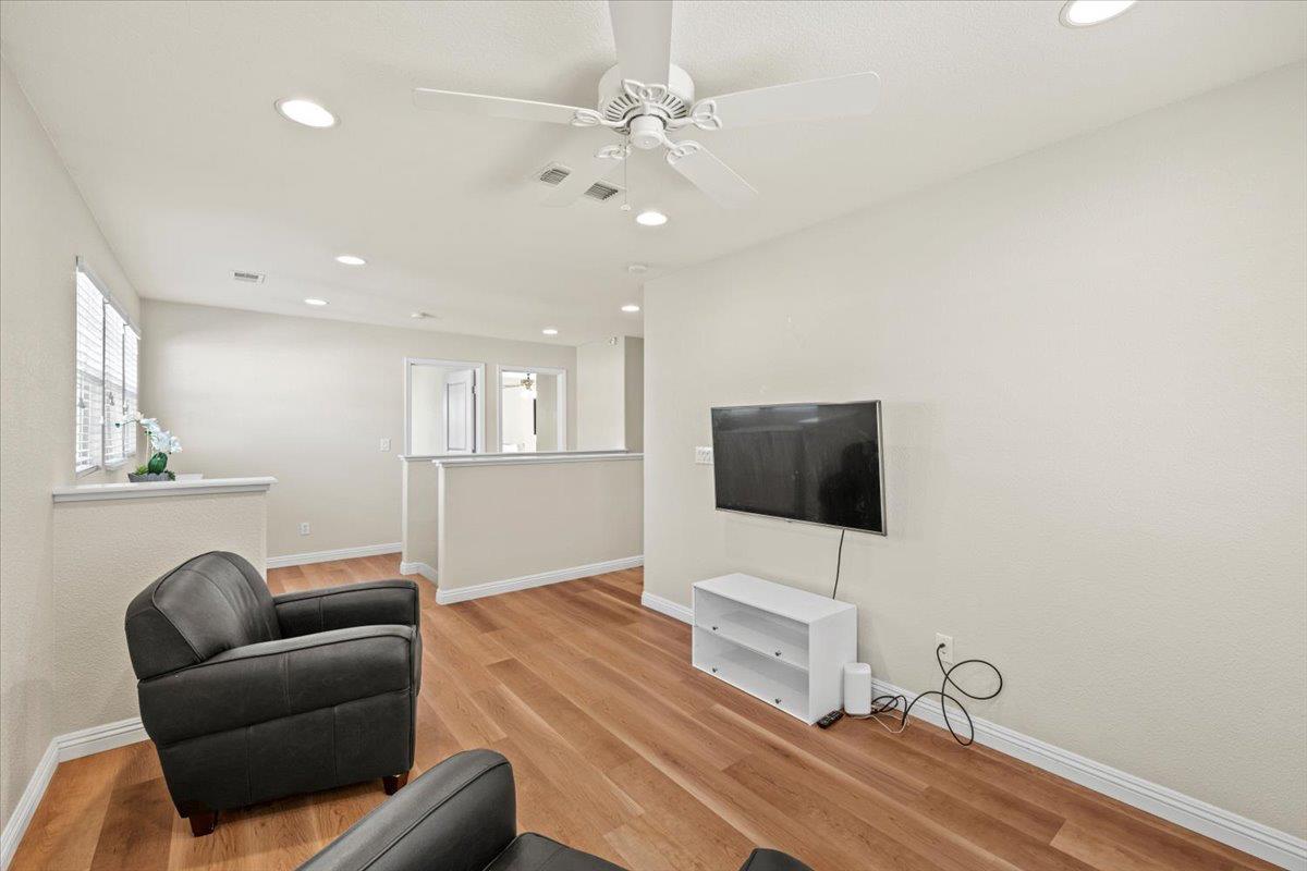 1000 Impressionist Loop Roseville, CA 95747 - Photo 18 of 33 a living room with furniture and a flat screen tv