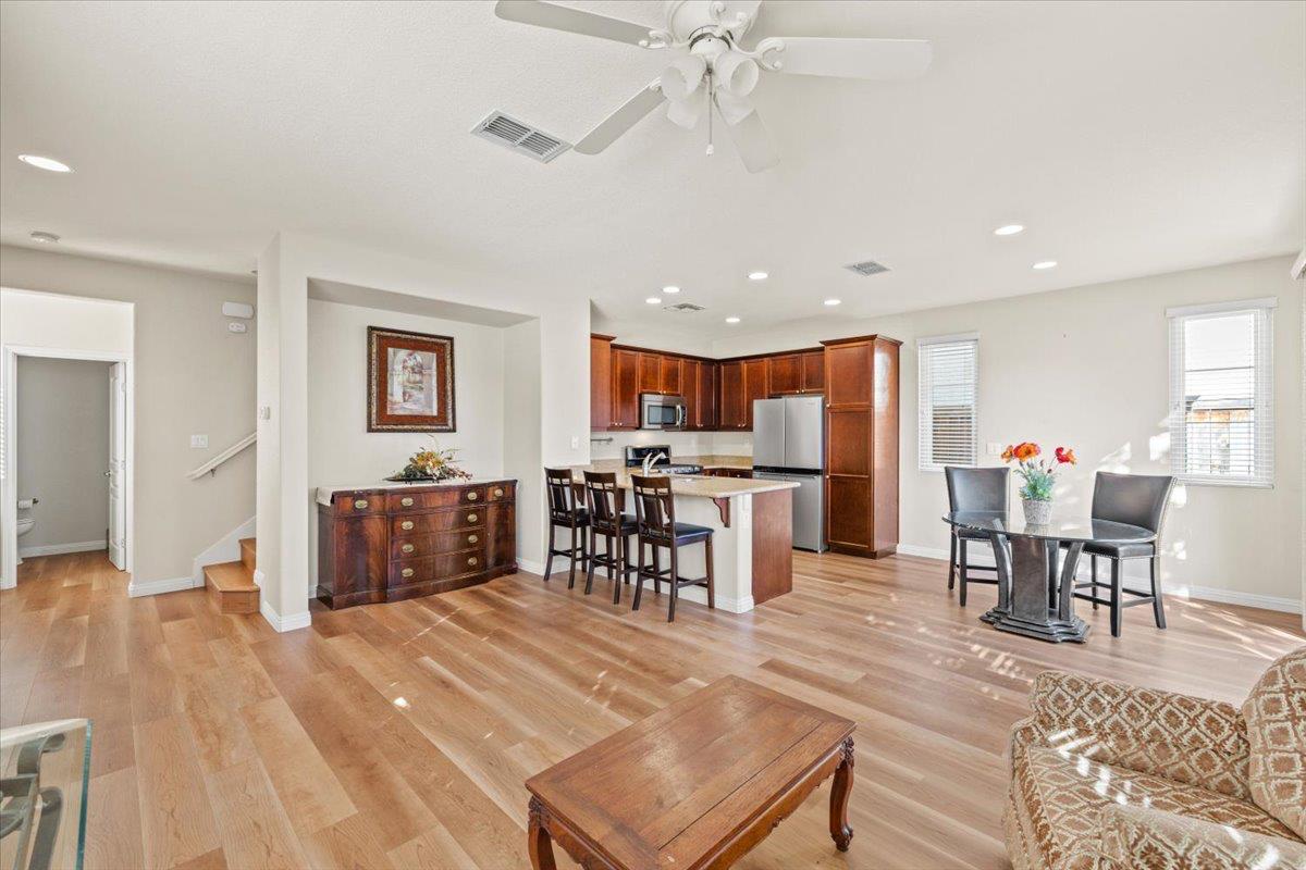 1000 Impressionist Loop Roseville, CA 95747 - Photo 6 of 33 a living room with stainless steel appliances furniture a dining table and kitchen view