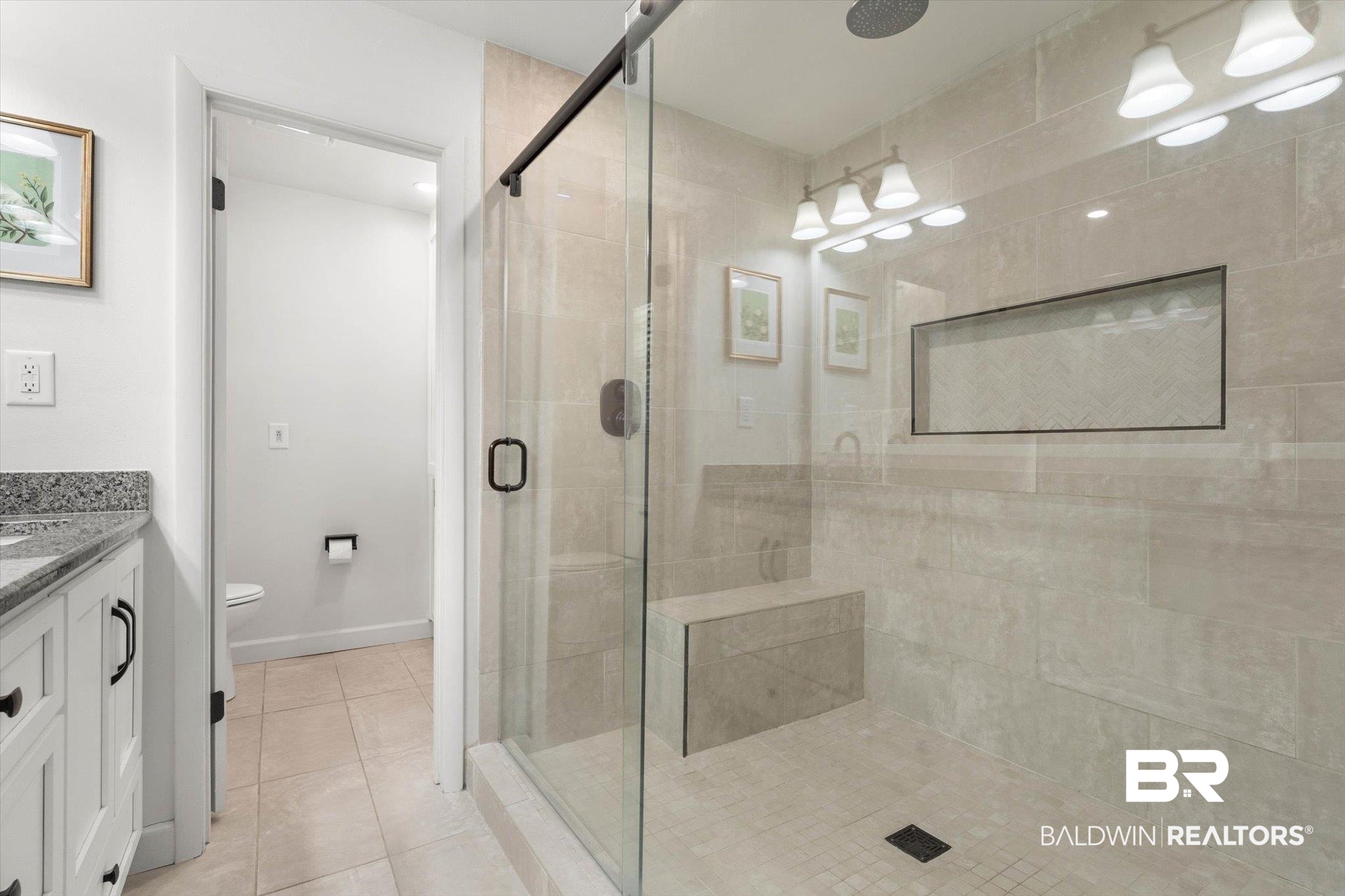 254 Woodlands Avenue Mobile, AL 36607 - Photo 23 of 50 Full bathroom with vanity, a shower stall, and light tile patterned floors