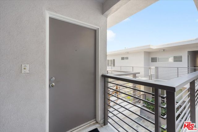 a kitchen with kitchen island a sink appliances and cabinets