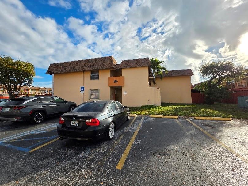 a view of a car parked in front of a house