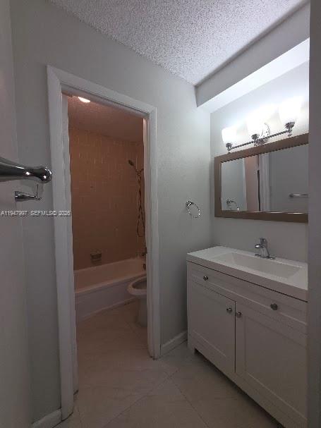 810 Southwest 129th Place, Unit 206 Miami, FL 33184 - Photo 12 of 16 a bathroom with a granite countertop sink a toilet a mirror and shower