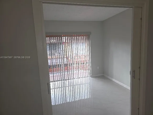 a view of a livingroom with a window