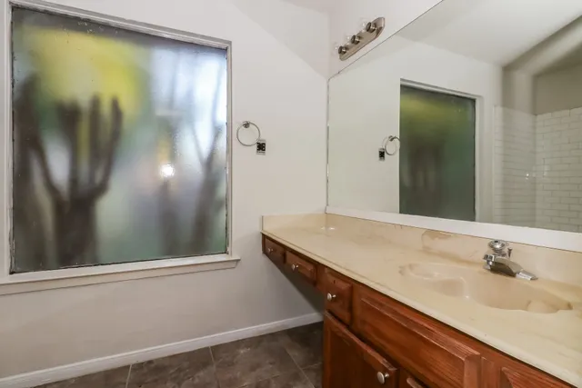 a bathroom with a sink and a mirror