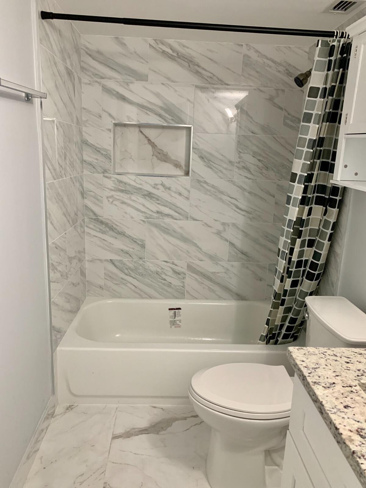 5700 Northwest 2nd Avenue, Unit 311 Boca Raton, FL 33487 - Photo 9 of 12 5700 311 2nd bathroom