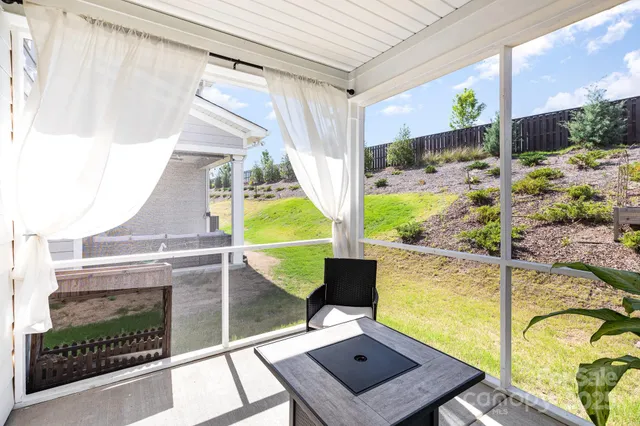 a view of a house with a yard and balcony