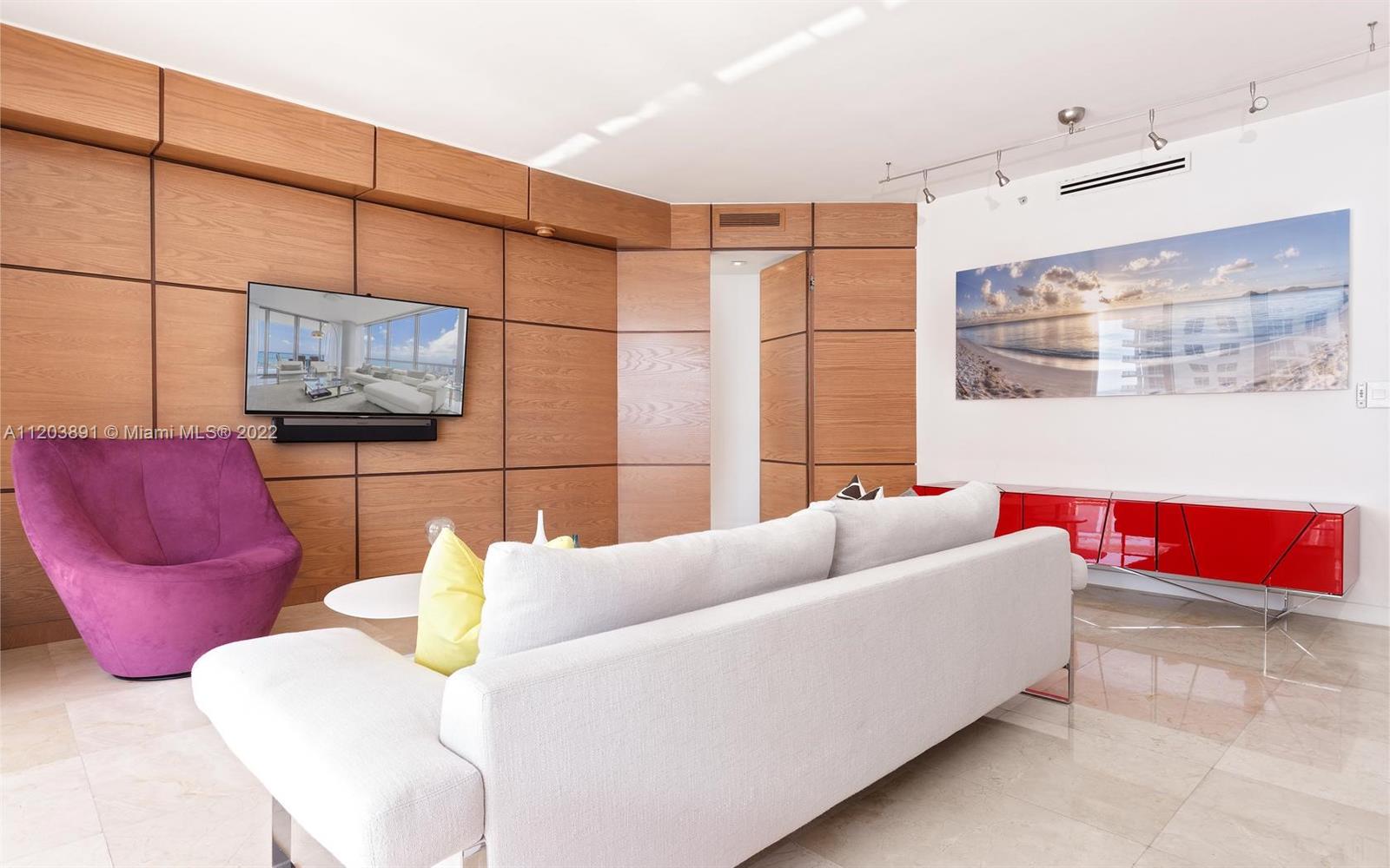 901 Brickell Key Boulevard, Unit 2503 Miami, FL 33131 - Photo 4 of 19 a living room with furniture